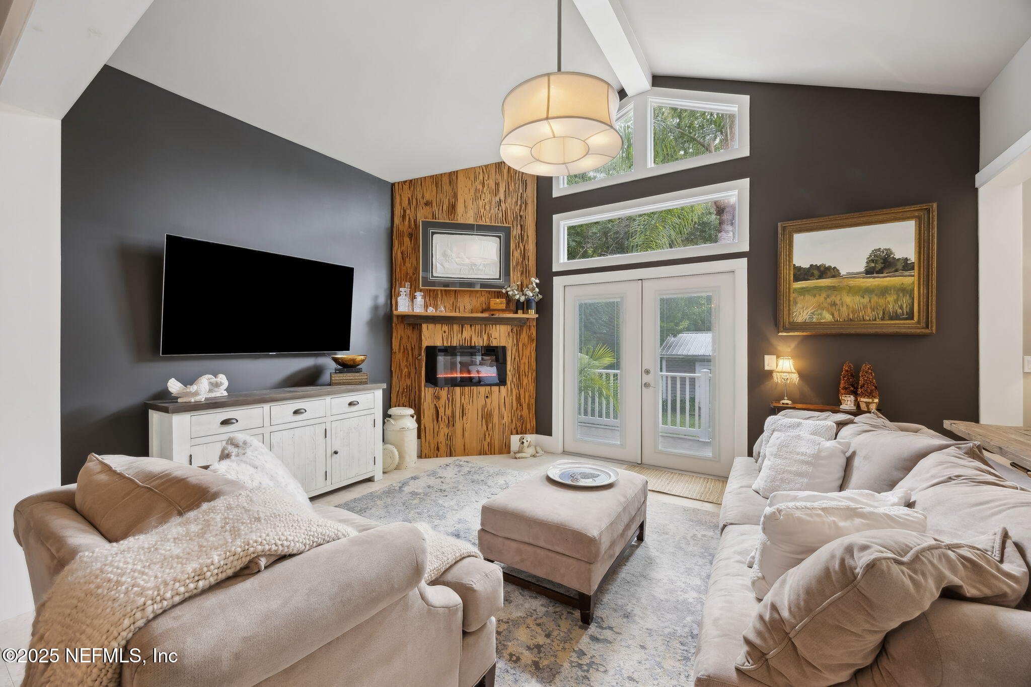 2245 Reed Street Orange Park, FL 32073 - Photo 85 of 107 a living room with furniture a flat screen tv and large window