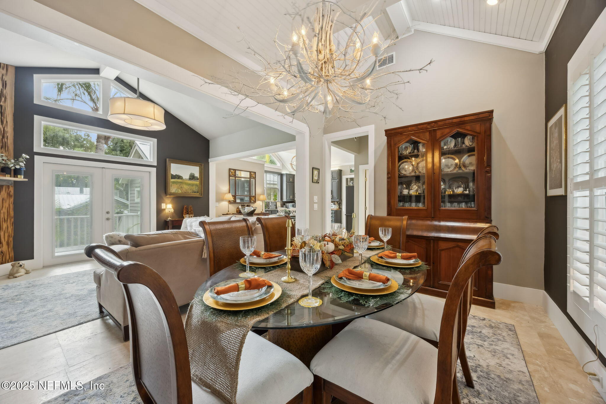 2245 Reed Street Orange Park, FL 32073 - Photo 88 of 107 a dining room with furniture a chandelier and window