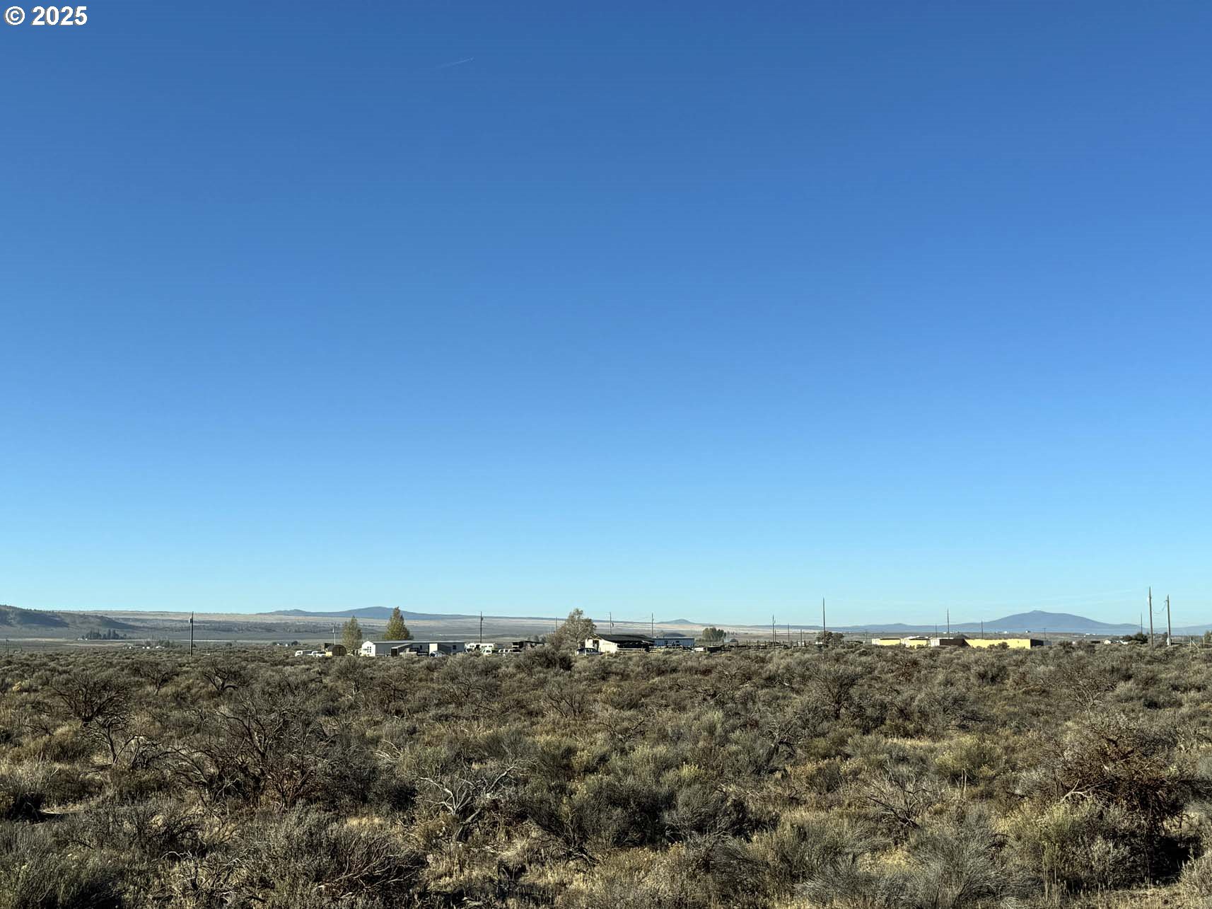 Pinion Lane, Unit 9200 Christmas Valley, OR 97641 - Photo 16 of 34 an aerial view of house and ocean