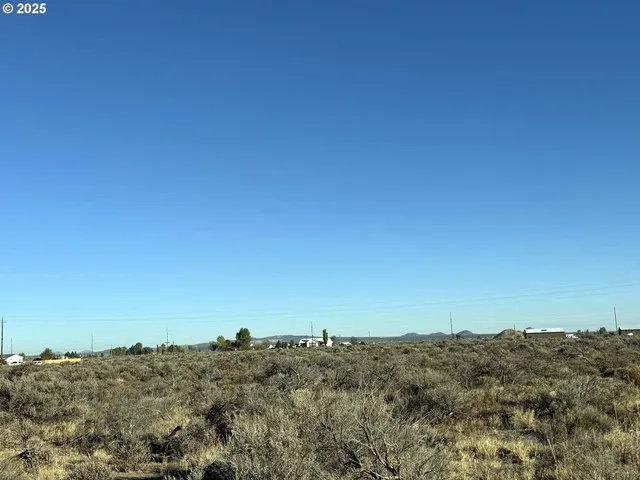 an aerial view of house and yard