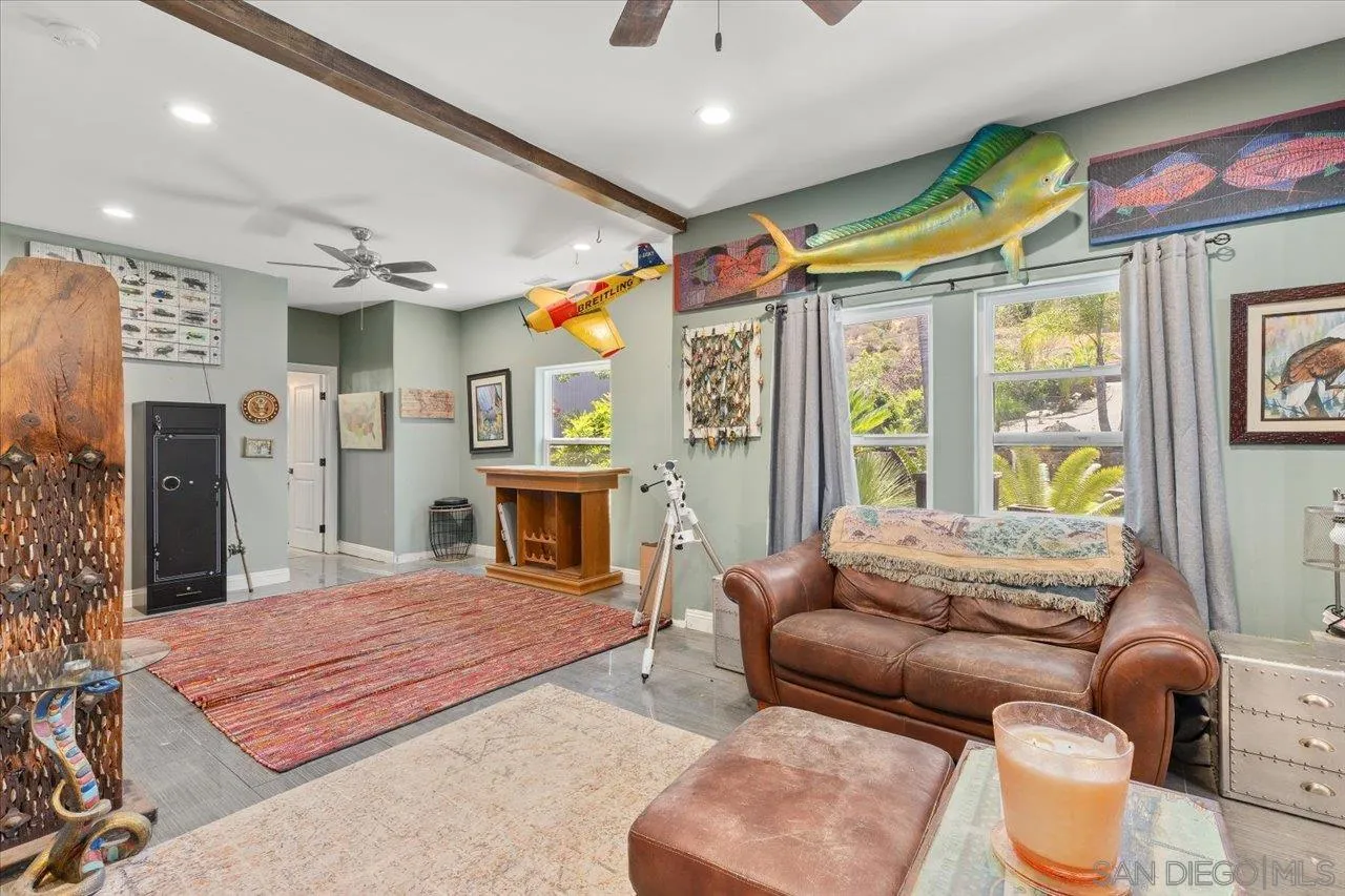 15786 Olde Highway 80 El Cajon, CA 92021 - Photo 17 of 75 a spacious bedroom with a bed a couch and a large window