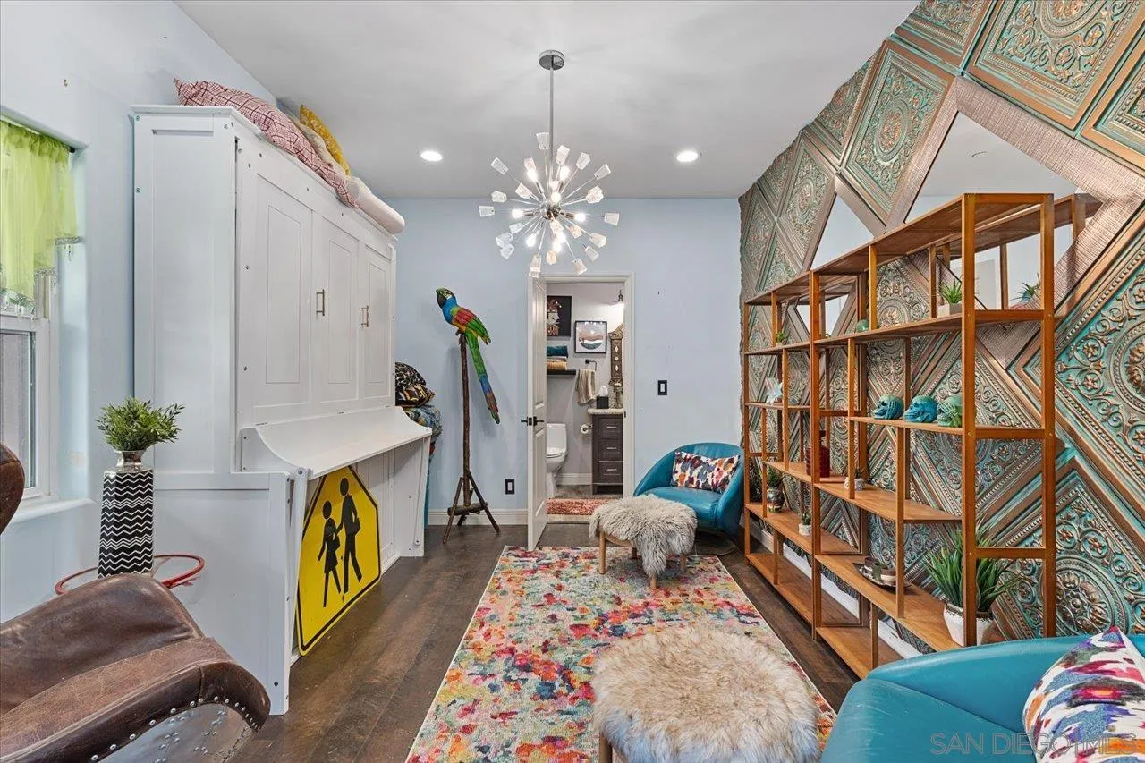 15786 Olde Highway 80 El Cajon, CA 92021 - Photo 21 of 75 a living room with furniture fireplace and a chandelier