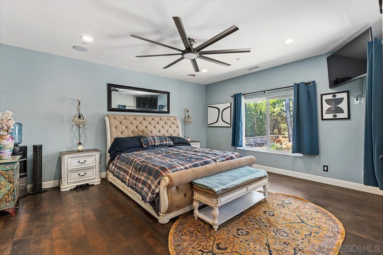 15786 Olde Highway 80 El Cajon, CA 92021 - Photo 33 of 75 a bedroom with a bed and a flat screen tv