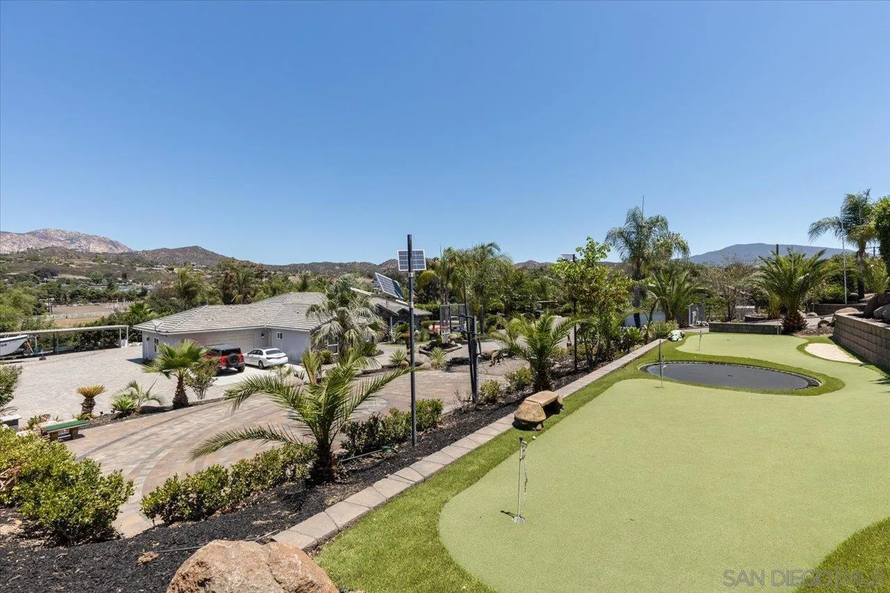 15786 Olde Highway 80 El Cajon, CA 92021 - Photo 58 of 75 a view of a swimming pool with a mountain view