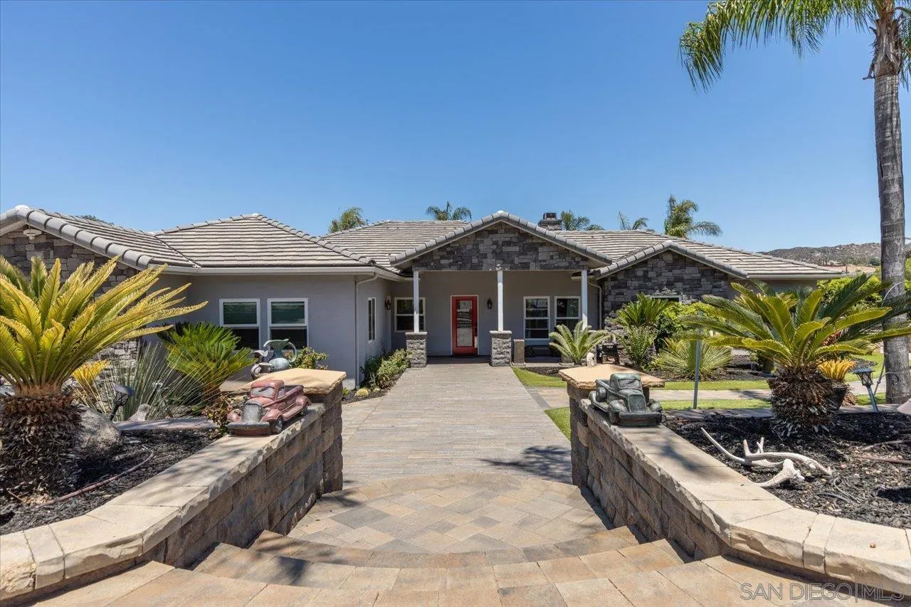 15786 Olde Highway 80 El Cajon, CA 92021 - Photo 10 of 75 a front view of a house with a garden