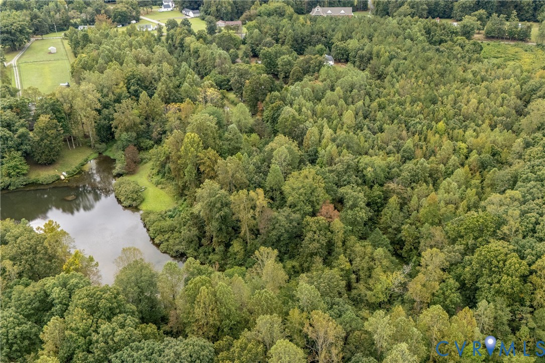 5210 Hopewell Road New Kent, VA 23124 - Photo 8 of 14 an aerial view of residential house with outdoor space and trees all around