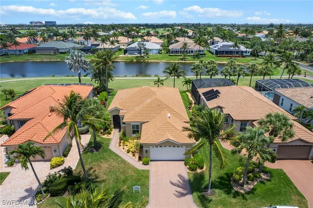 an aerial view of a house with a lake view
