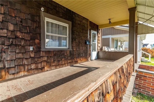 a view of a house with wooden floor and a window