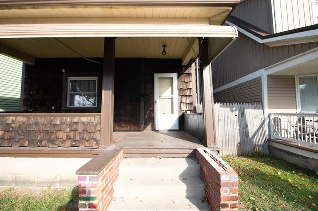 a view of a house with porch and furniture