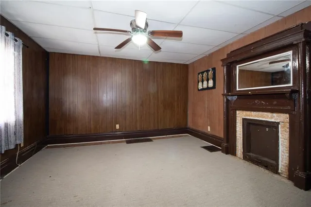 a view of an empty room with a fireplace