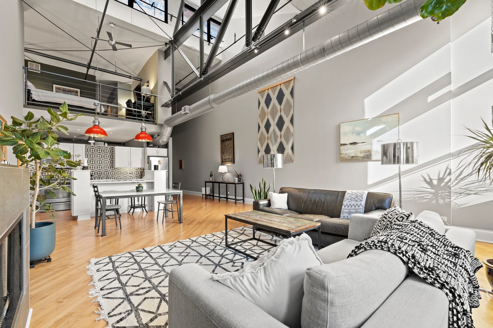 203 South Sangamon Street, Unit 306 Chicago, IL 60607 - Photo 13 of 30 a living room with furniture and a chandelier