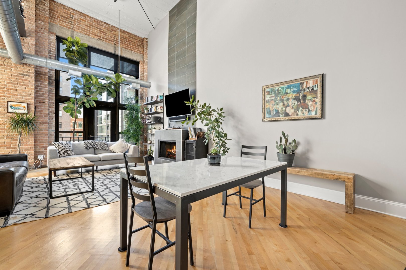 203 South Sangamon Street, Unit 306 Chicago, IL 60607 - Photo 15 of 30 a view of a dining room with furniture and wooden floor