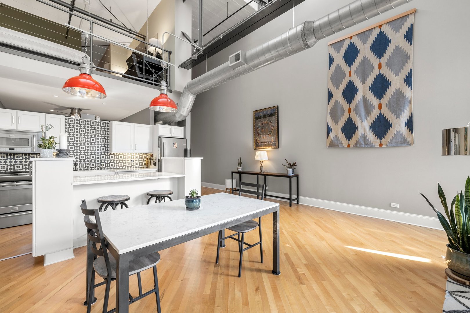203 South Sangamon Street, Unit 306 Chicago, IL 60607 - Photo 16 of 30 a view of a dining room with furniture and wooden floor