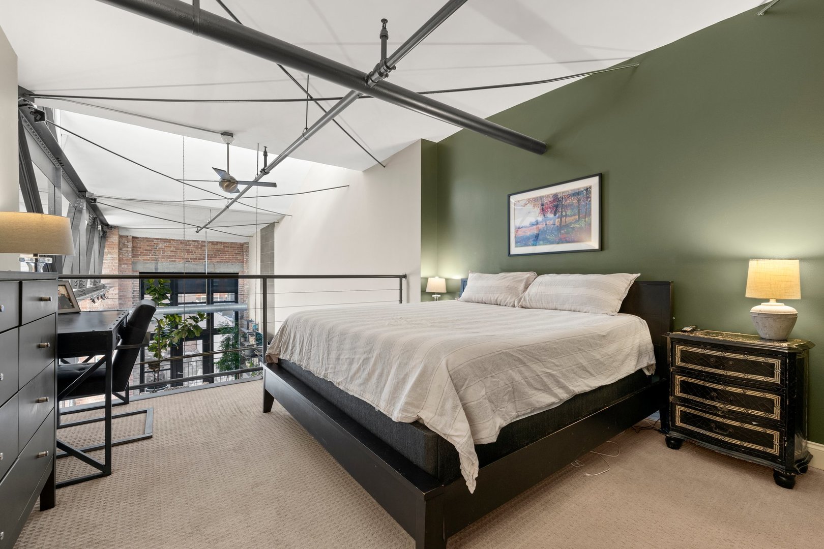 203 South Sangamon Street, Unit 306 Chicago, IL 60607 - Photo 17 of 30 a bedroom with a bed and chair