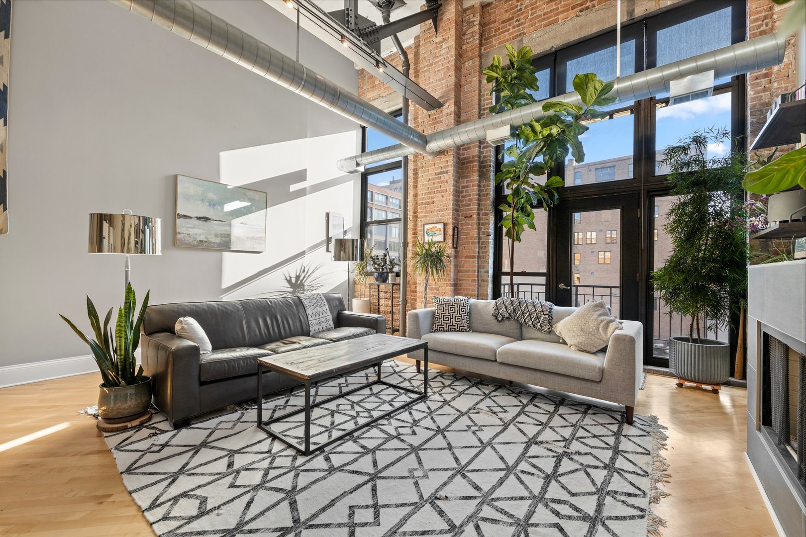 203 South Sangamon Street, Unit 306 Chicago, IL 60607 - Photo 5 of 30 a living room with furniture flower pot and a table
