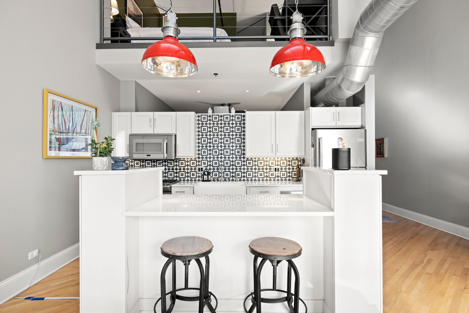 203 South Sangamon Street, Unit 306 Chicago, IL 60607 - Photo 9 of 30 a kitchen with stainless steel appliances kitchen island granite countertop a stove and white cabinets