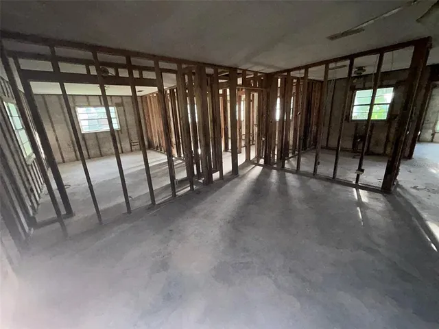 a view of a garage with wooden floor