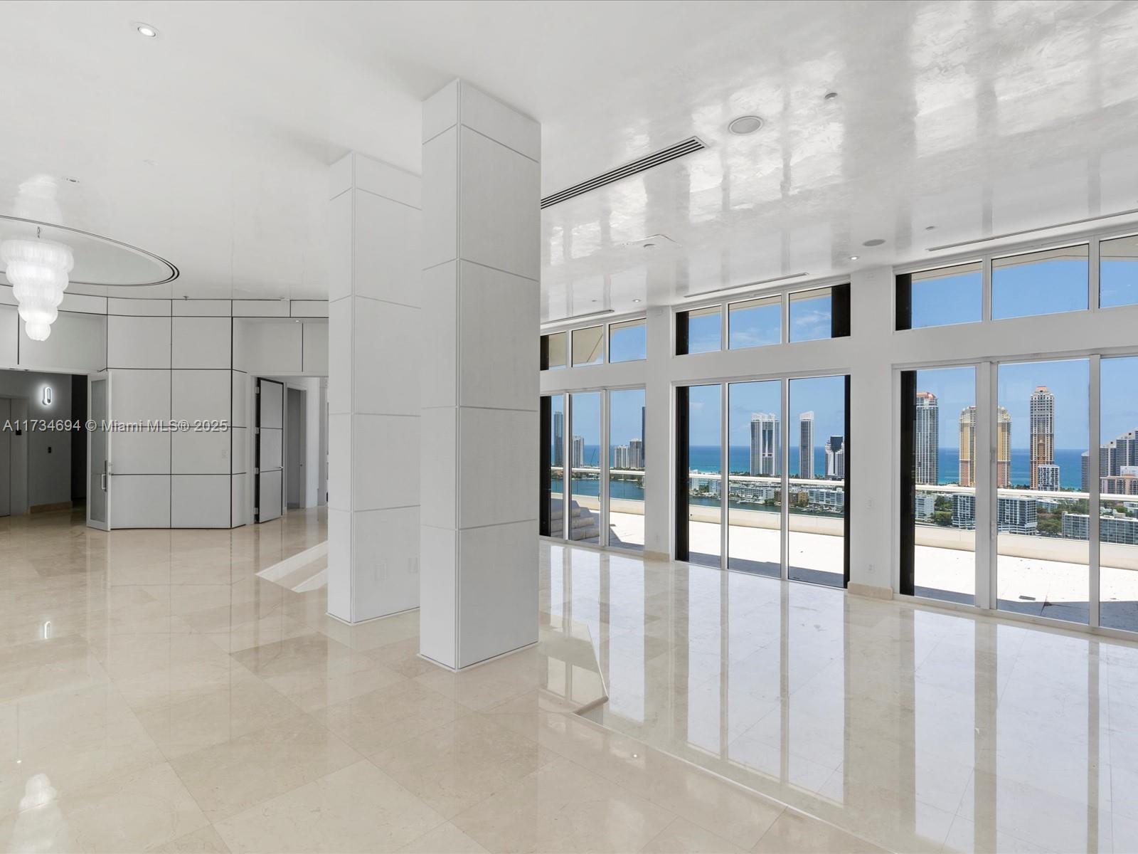 2600 East Island Boulevard, Unit PH3 Aventura, FL 33160 - Photo 2 of 14 a view of a hallway with a ceiling fan
