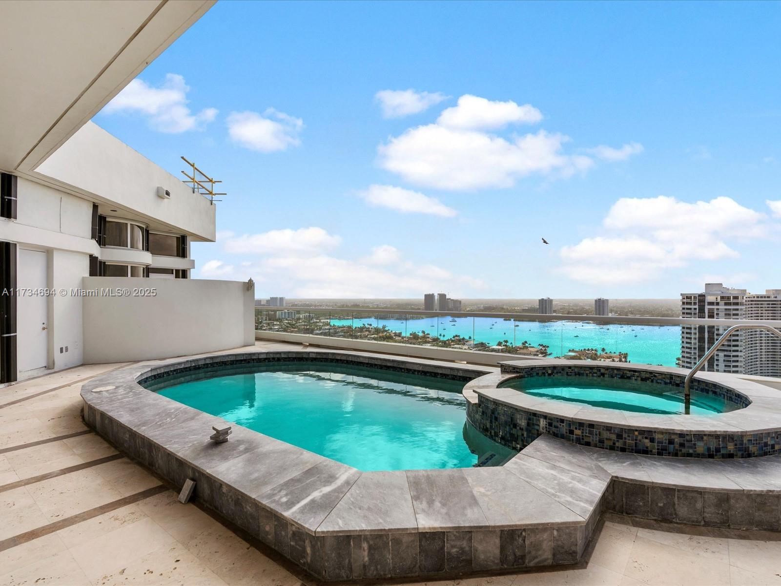 2600 East Island Boulevard, Unit PH3 Aventura, FL 33160 - Photo 6 of 14 a view of a swimming pool and outdoor space