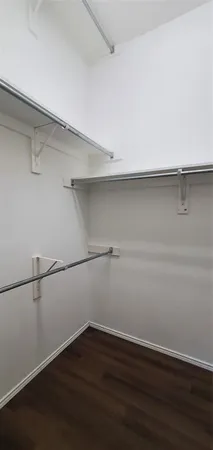 a view of an empty walk in closet