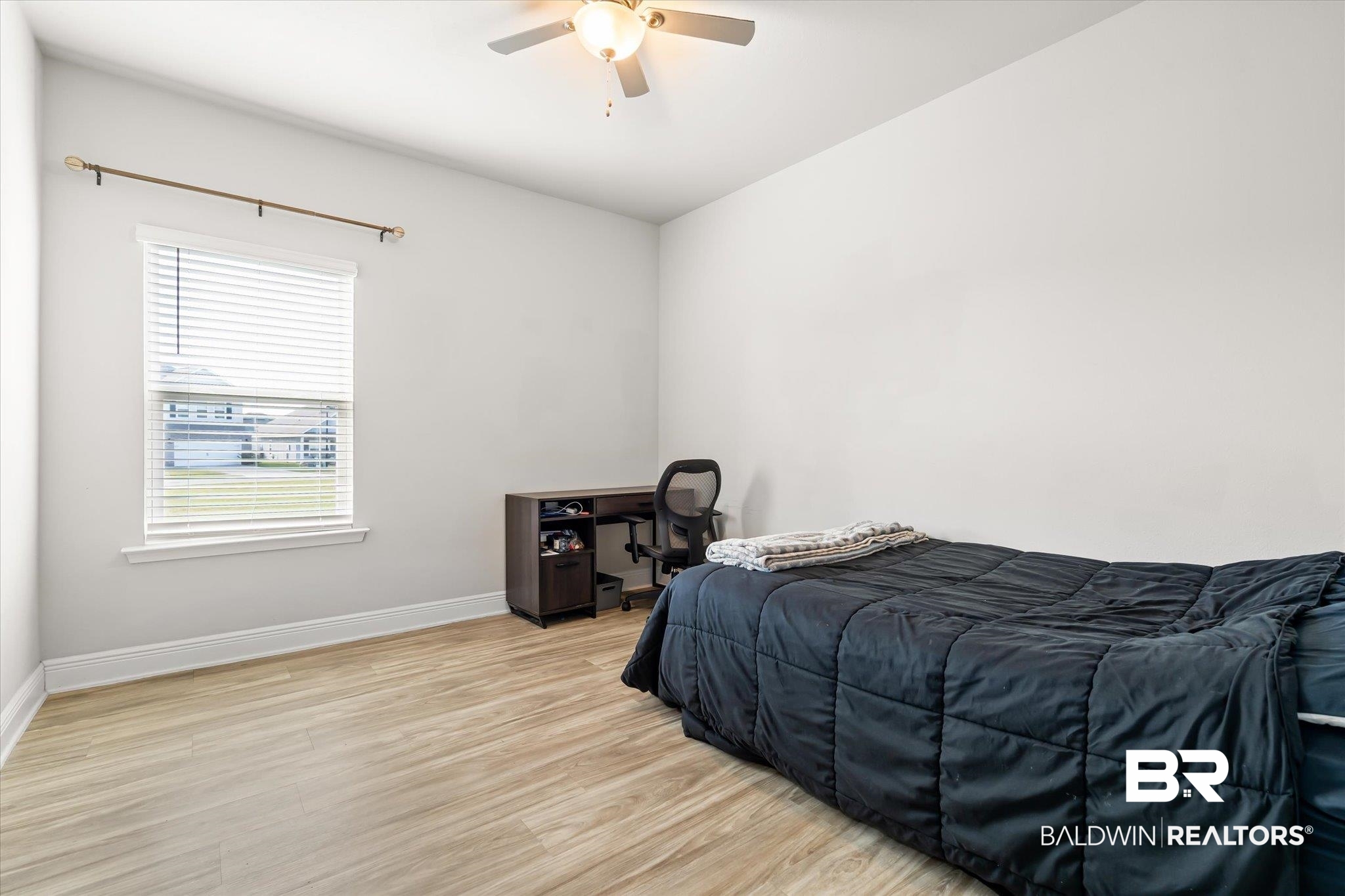 24262 Alydar Loop Daphne, AL 36526 - Photo 13 of 33 Bedroom featuring light wood-style floors, ceiling fan, and baseboards