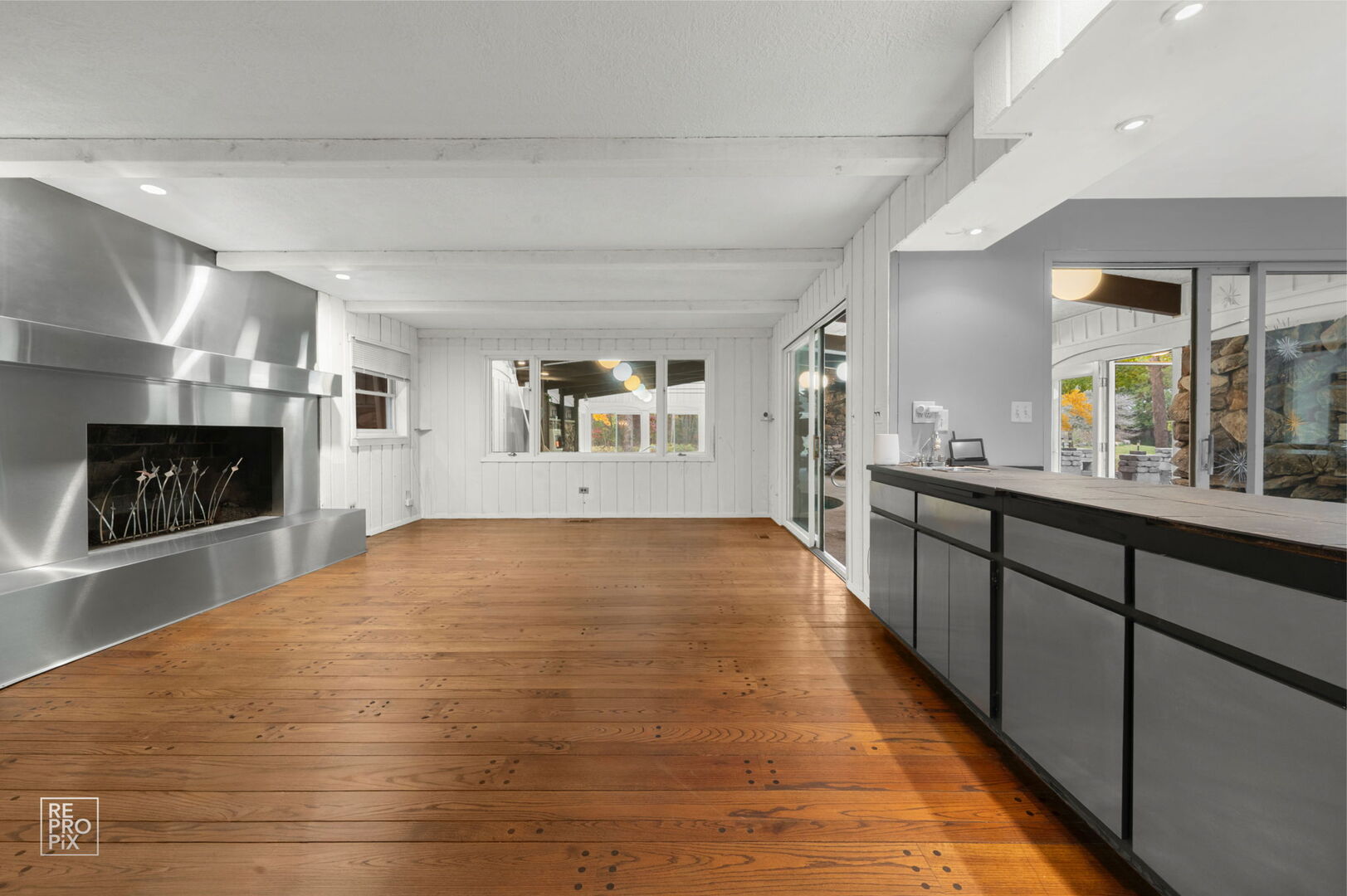 14930 West Wadsworth Road Wadsworth, IL 60083 - Photo 14 of 68 a large white kitchen with kitchen island a sink dishwasher stove and oven with wooden floor