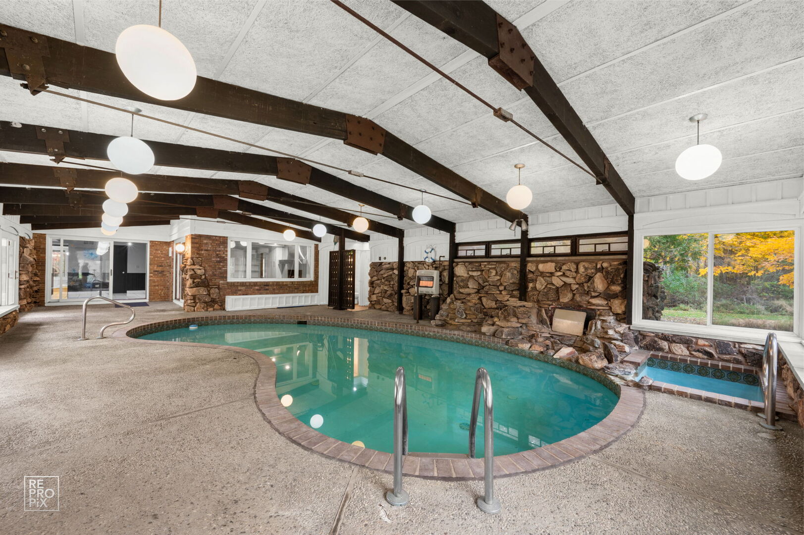 14930 West Wadsworth Road Wadsworth, IL 60083 - Photo 24 of 68 a view of a swimming pool with a porch