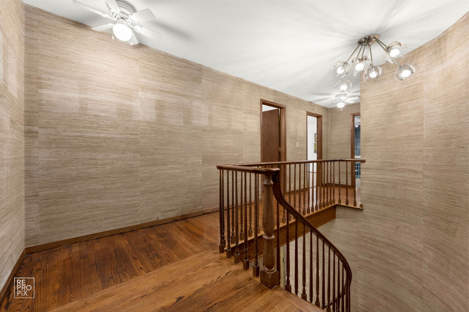 14930 West Wadsworth Road Wadsworth, IL 60083 - Photo 28 of 68 a view of a hallway with wooden floor and staircase