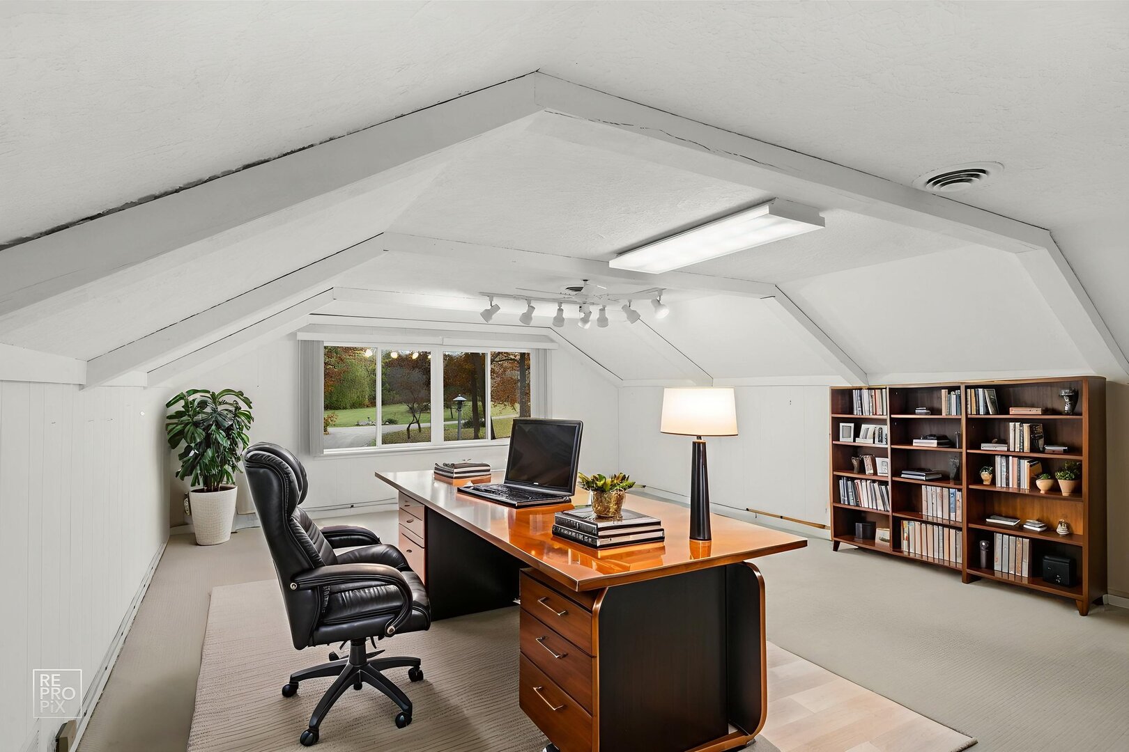 14930 West Wadsworth Road Wadsworth, IL 60083 - Photo 34 of 68 a view of a workspace with furniture and a potted plant
