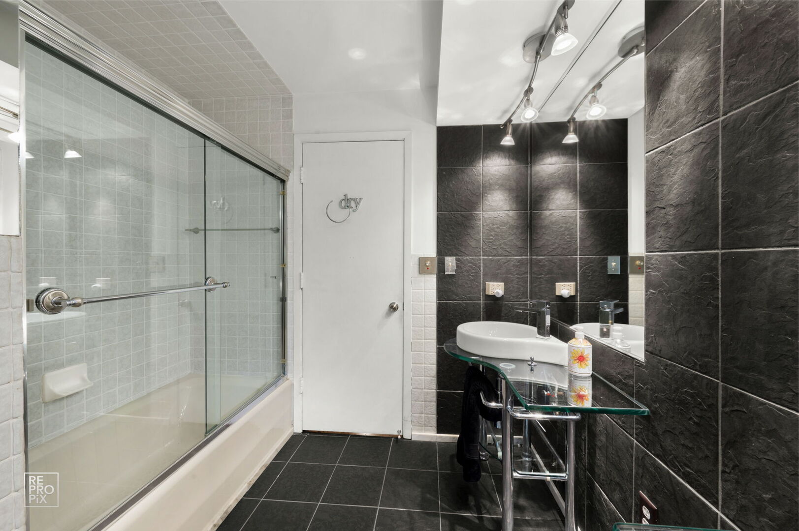 14930 West Wadsworth Road Wadsworth, IL 60083 - Photo 36 of 68 a bathroom with a sink and a mirror