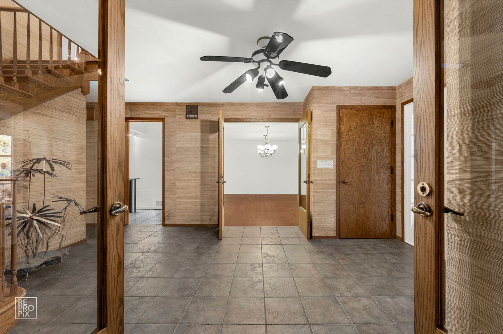 14930 West Wadsworth Road Wadsworth, IL 60083 - Photo 9 of 68 a view of a hallway with a chandelier