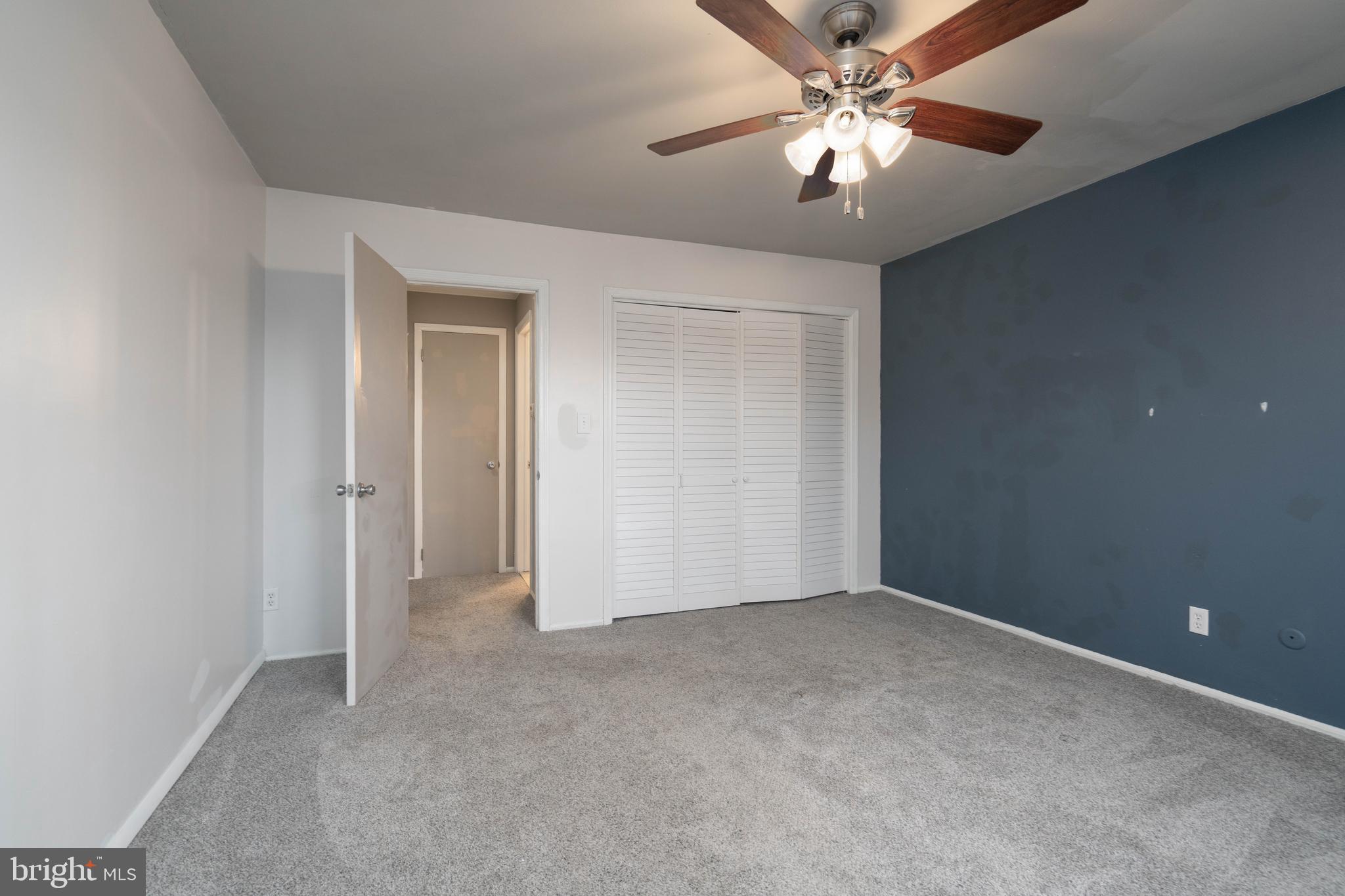902 Garnet Drive Burlington, NJ 08016 - Photo 11 of 15 a view of an empty room and chandelier fan
