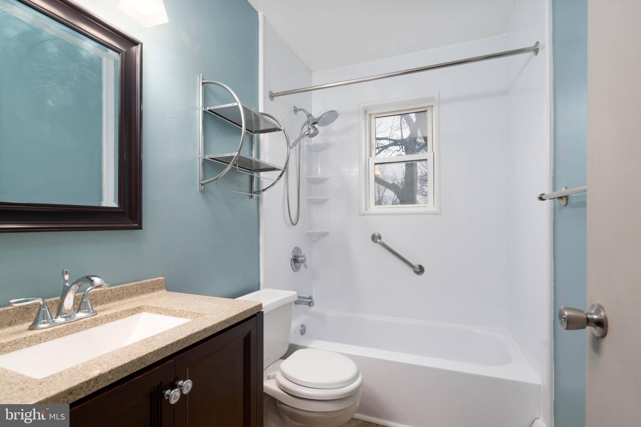 902 Garnet Drive Burlington, NJ 08016 - Photo 12 of 15 a bathroom with a granite countertop sink toilet and shower