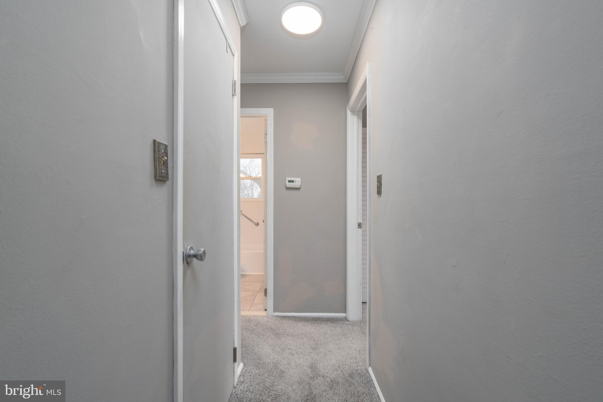 902 Garnet Drive Burlington, NJ 08016 - Photo 8 of 15 a view of a livingroom from a hallway
