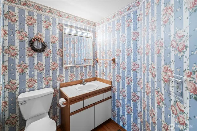a view of a bathroom from a hallway