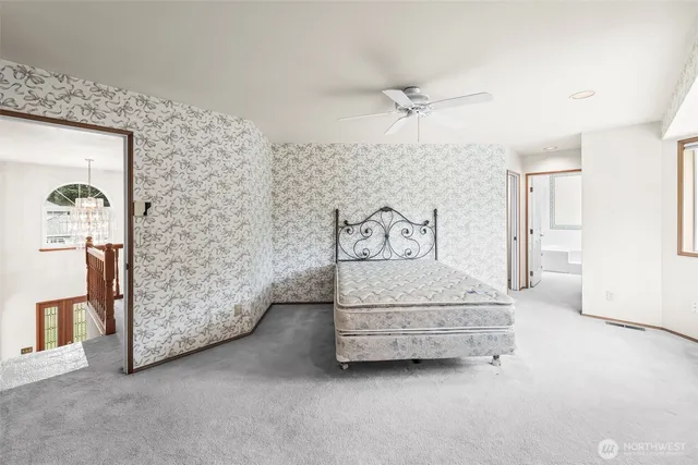 a bathroom with a sink a large mirror and a bathtub