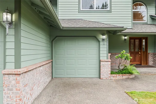 a front view of a house with a garage