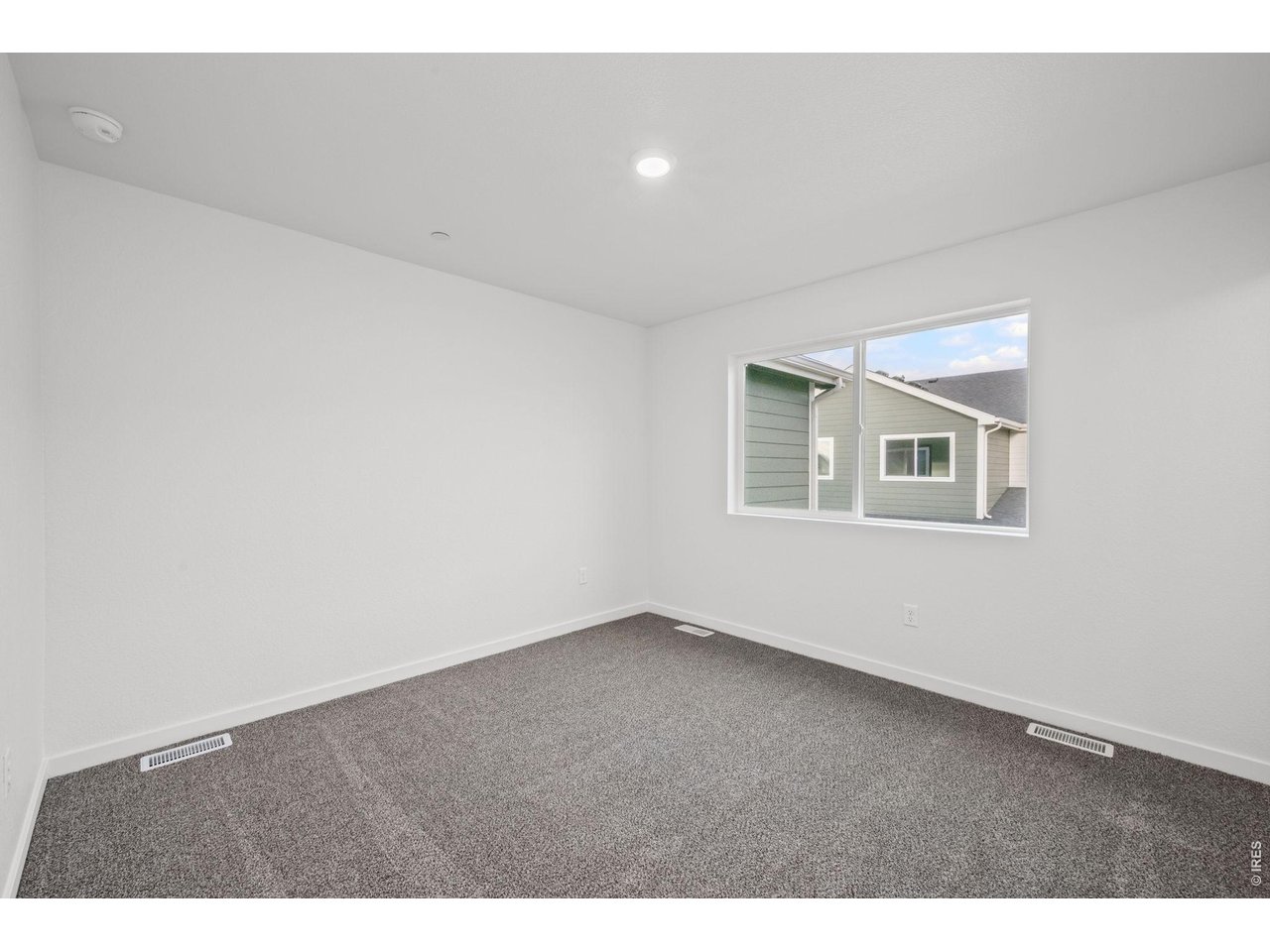 3905 Net Street Evans, CO 80620 - Photo 15 of 19 a view of an empty room with a window