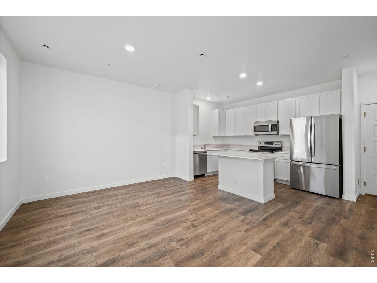 3905 Net Street Evans, CO 80620 - Photo 6 of 19 a view of kitchen with wooden floor
