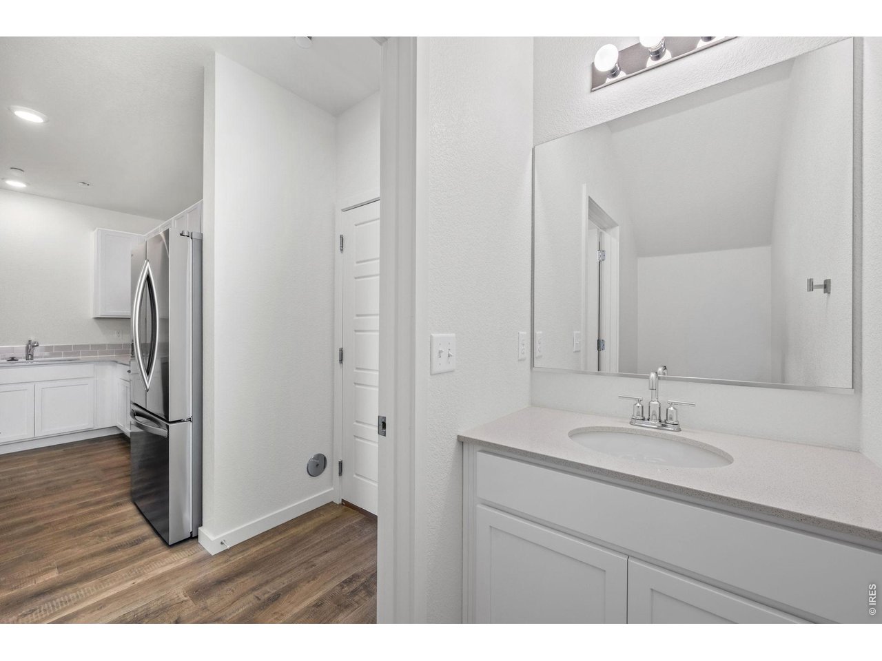 3905 Net Street Evans, CO 80620 - Photo 8 of 19 a bathroom with a sink shower and a mirror