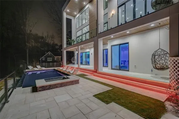a front view of a house with a swimming pool