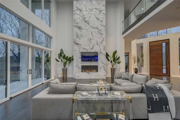 a living room with furniture and a fireplace