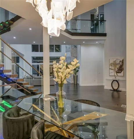 a view of living room with furniture and chandelier