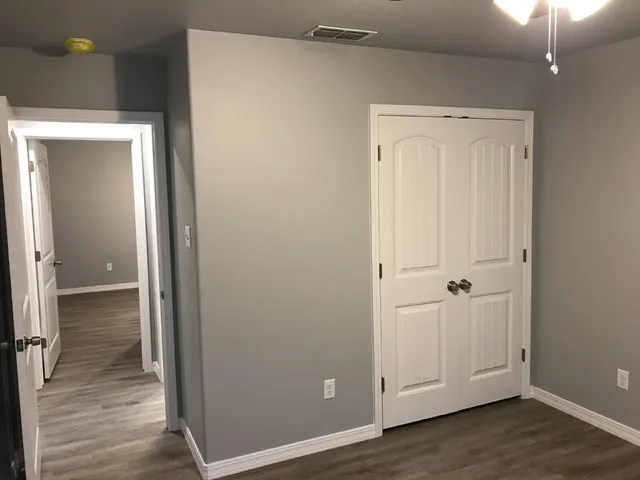 a view of a livingroom with wooden floor