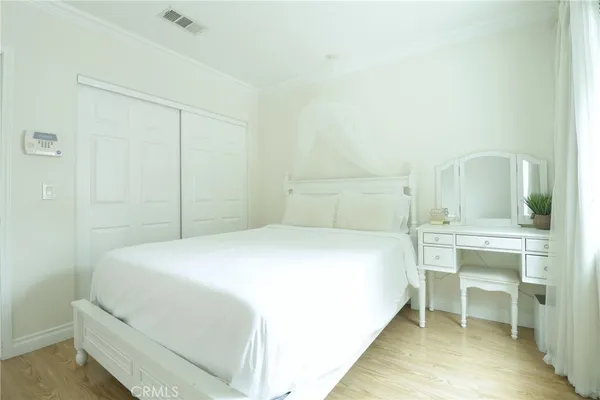 a bedroom with a bed and a table