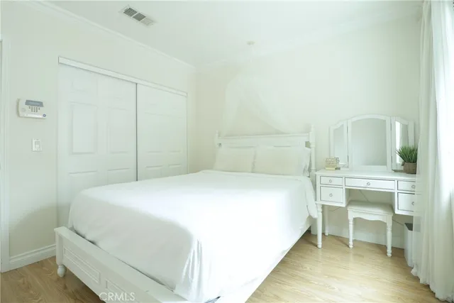 a bedroom with a bed and a table