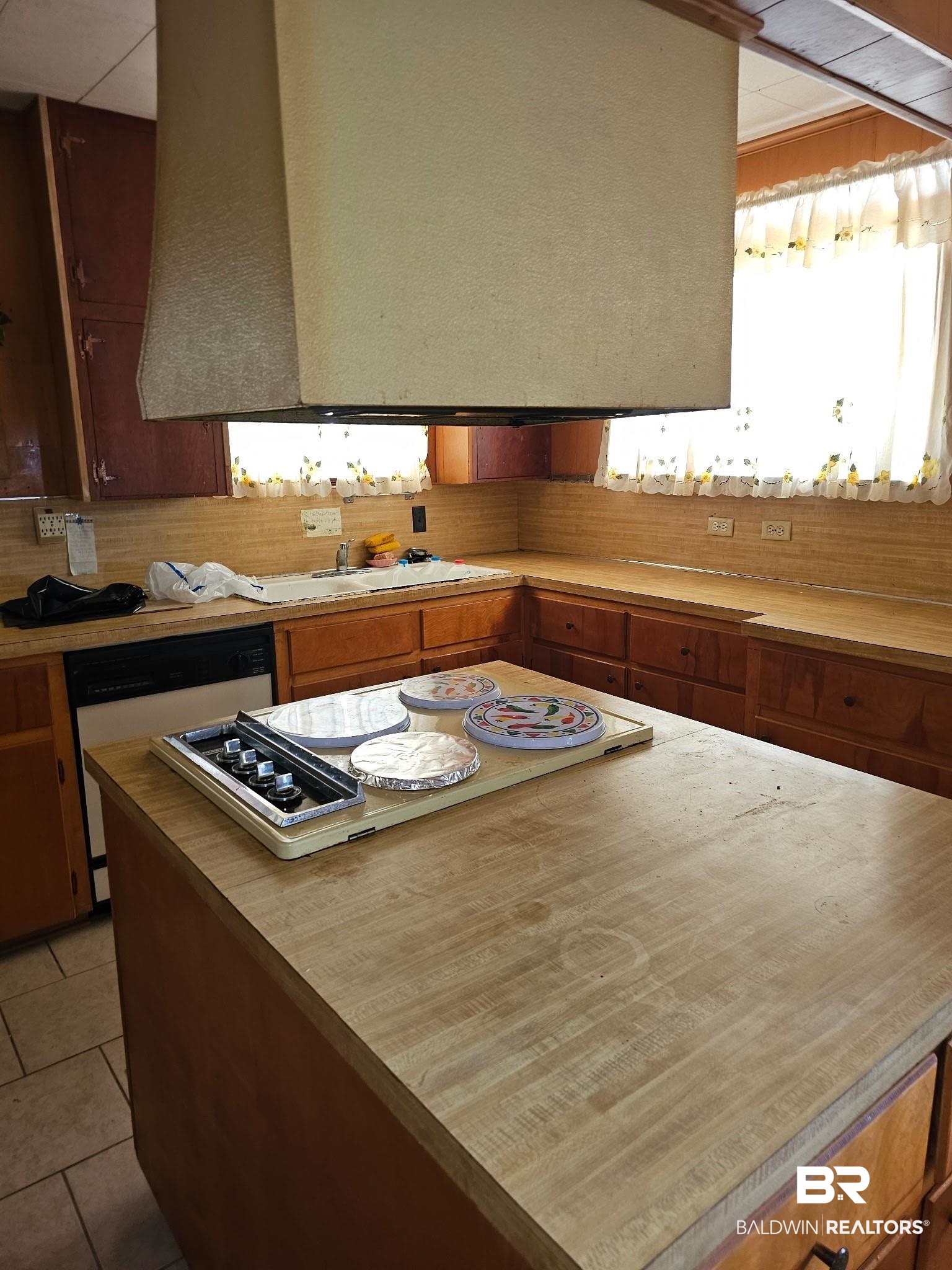 304 Sutherland Drive Mobile, AL 36611 - Photo 5 of 18 Kitchen featuring dishwashing machine, sink, tasteful backsplash, white gas stovetop, and light tile patterned flooring