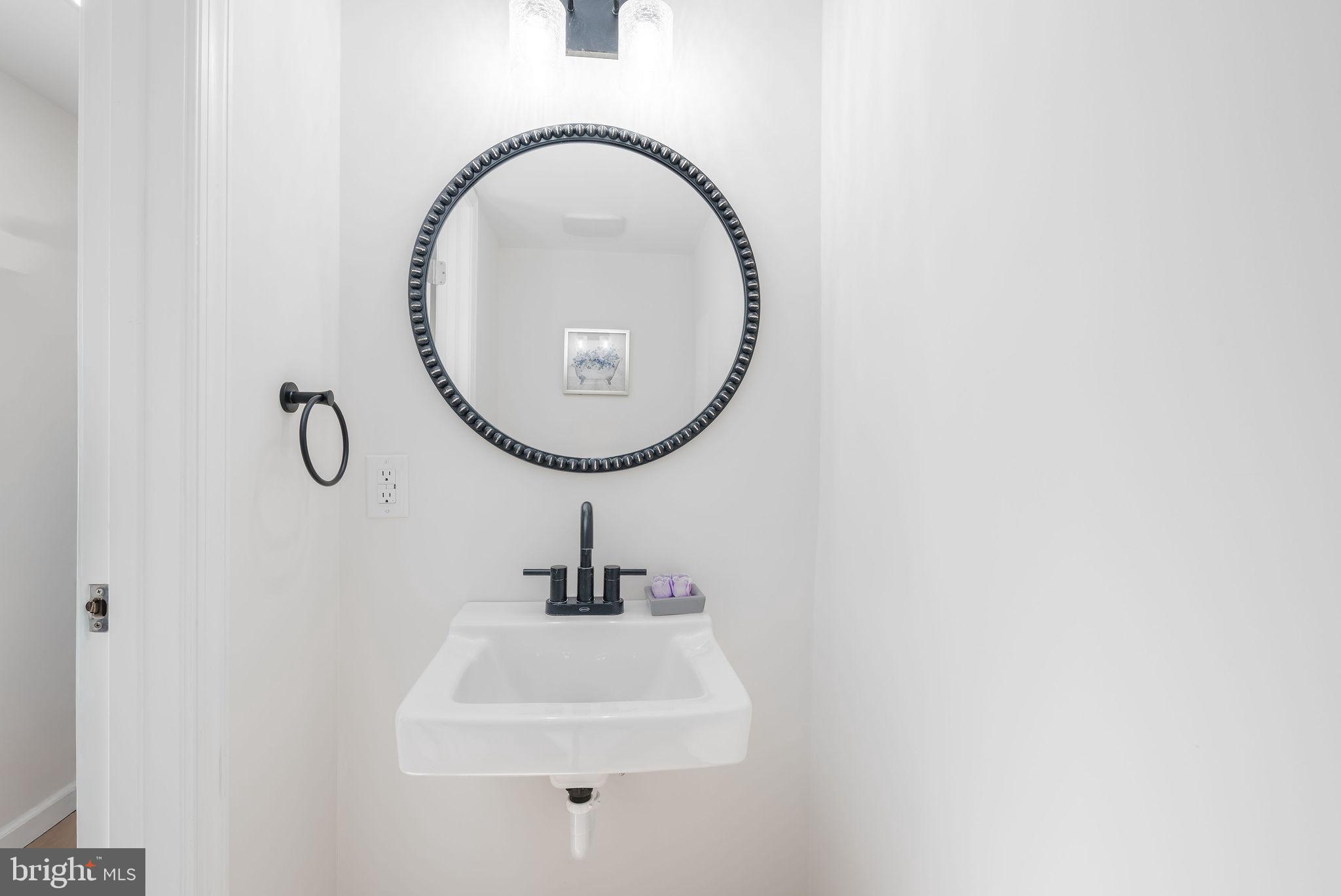 20121 Nanticoke Road Nanticoke, MD 21840 - Photo 27 of 88 a bathroom with a sink and a mirror