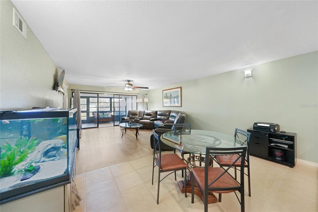 240 Lewis Circle, Unit 513 Punta Gorda, FL 33950 - Photo 11 of 45 a view of a dining room with furniture and a potted plant