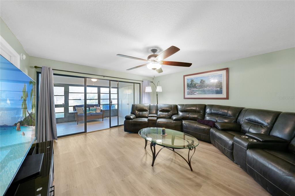 240 Lewis Circle, Unit 513 Punta Gorda, FL 33950 - Photo 13 of 45 a living room with furniture and a large window
